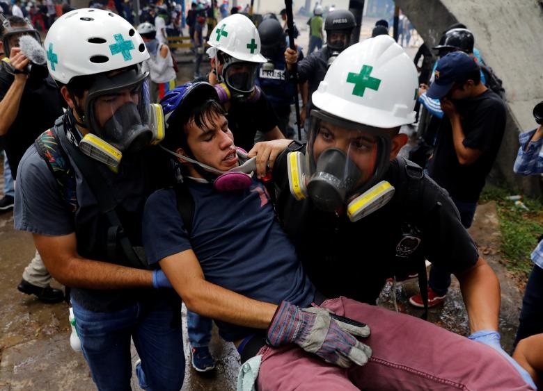 تصاویر : حضور کلاه‌سفیدها در درگیری‌های خیابانی ونزوئلا