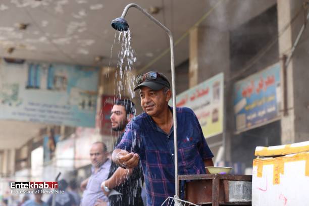 تصاویر : دوش آب سرد در خیابان‌های بغداد