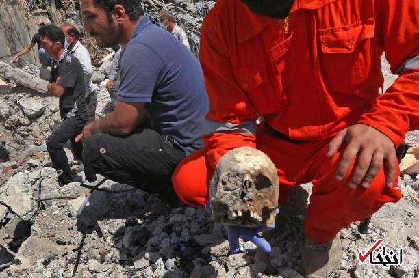 تصاویر دلخراش : بیرون کشیدن اجساد از زیر آوارهای موصل